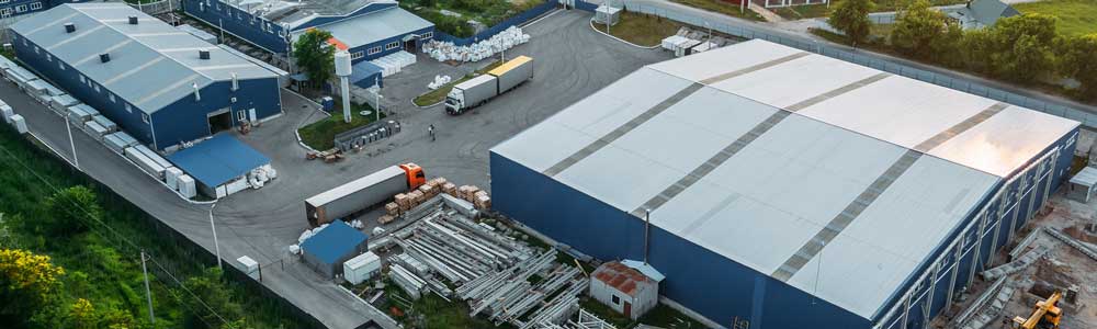 newbremen-success-story-safeway-EXAMPLE Aerial shot of factory building with metal roof, scrap metal outside and trucks arriving and leaving
