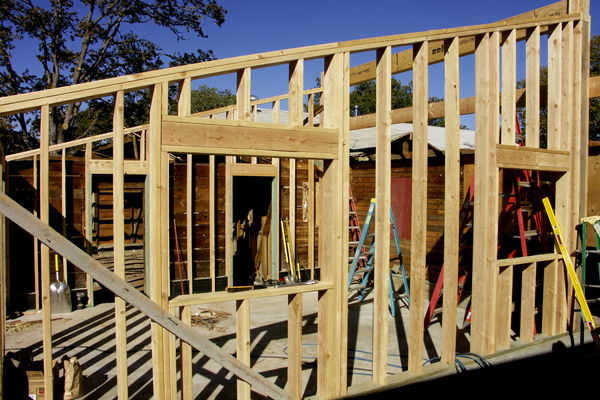 shedbuilding Home being built or added on to with wooden slat walls and windows